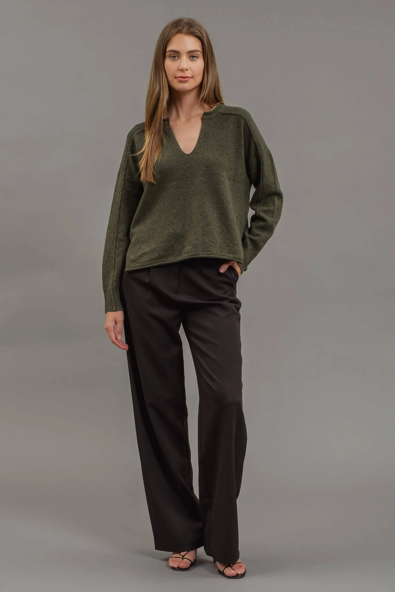 EXPOSED SEAM SPLIT NECK KNIT SWEATER