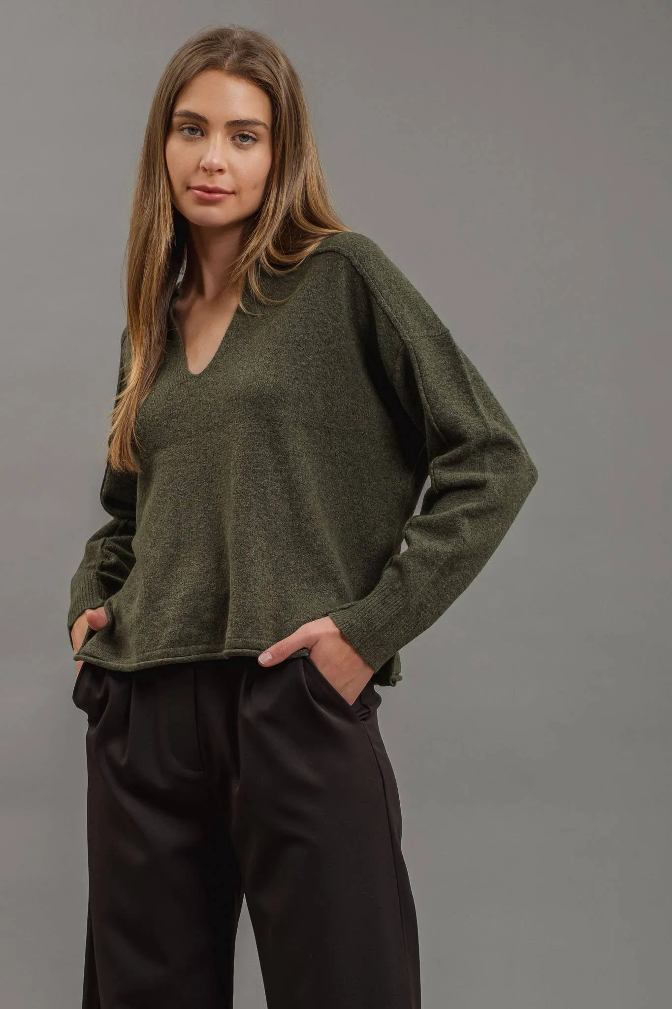 EXPOSED SEAM SPLIT NECK KNIT SWEATER