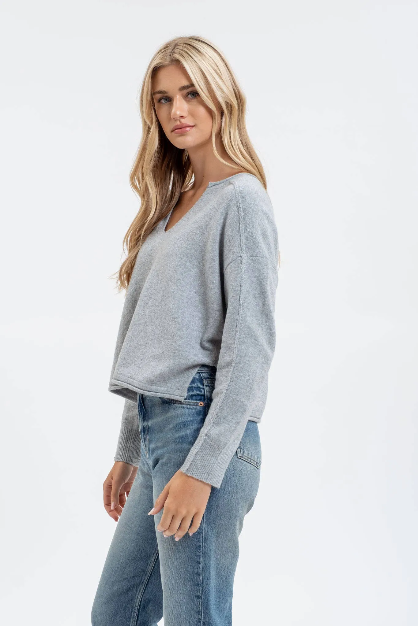 EXPOSED SEAM SPLIT NECK KNIT SWEATER
